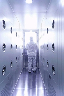 Industrious Prints: Worker wearing protective clothing in ecigarette factory