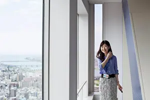 Asian And Indian Ethnicities Prints: A working woman in an office building