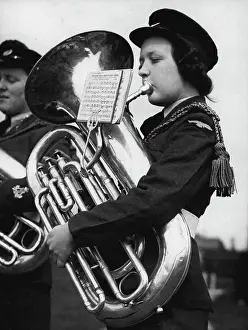 Instrument Prints: Wraf's Big Blow - Aircraftswoman Doreen Andrew of Neither Wallop practising on a massive bass at Hanlow to-day