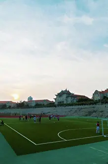 Large Group Prints: Xiamen University Stadium at sunset with some students playing sports; Xiamen