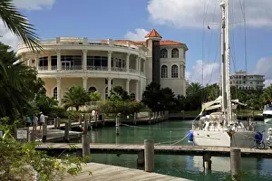 Mast Prints: Yacht moored in a harbor in front of a casino