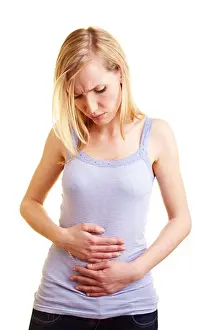 Suffer Prints: Young blonde woman with stomach ache holding her belly