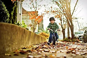 Out Door Prints: Young boy riding his bike