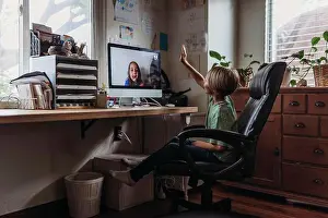 Video Prints: Young boy video chatting with family remotely during isolation