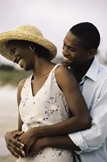 Rolled Up Sleeves Prints: Young couple holding each other on the beach