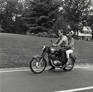 The Way Forward Prints: Young couple riding motorcycle