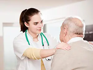 Responsible Prints: Young doctor taking care of an elderly man