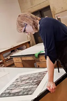 Thoughtful Prints: Young female art student creating prints in studio, edmonton alberta canada