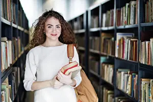 Campus Prints: Young female student in library