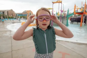 Gradeschooler Prints: Young girl with goggles and nose plug at water park