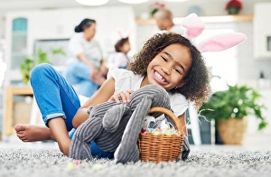 Easter Prints: a young girl sitting on the floor with easter eggs at home