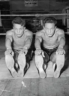 Stretch Prints: The Young One two -- Heavyweight twins prepare for battle -- Boxers have been known to appear in duplicate to their