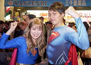 Halloween Prints: Young Japanese couple dressed as Superman and Superwoman at the Halloween celebrations in Shibuya