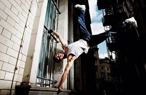 Brickwall Prints: Young man breakdancing