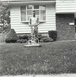 Cutting Prints: Young man cutting grass with a lawn mower