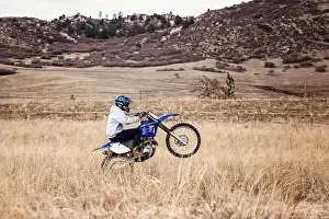 Exciting Prints: Young Man Dirt Biking in the Foothills in Colorado