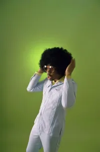 Colored Background Prints: Young man with his hand in his hair