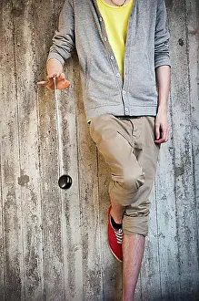 Hobbies Prints: Young man playing with a yo-yo