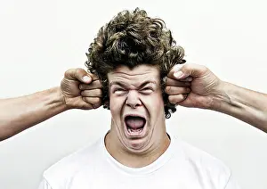 Front Views Prints: Young man shouting while being attacked by fists, headache