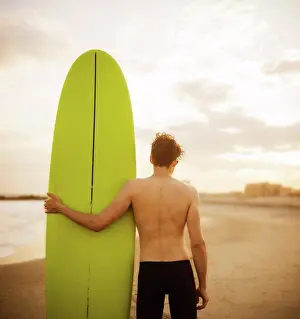 Wellness Prints: young man with a surfboard