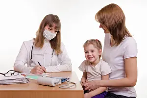 Examination Prints: Young mother with her child sitting in his office at the pediatrician Woman with a small child on reception