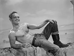 Smoking Prints: Young Muscular Shirtless Male Reclining Outdoors c.1961