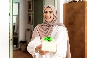 Bame Prints: Young muslim woman giving a gift