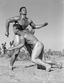 Young Men Prints: Two Young Nude Males Wrestle in the Desert c.1950
