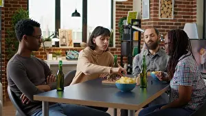 Decision Prints: Young people playing board games together in apartment