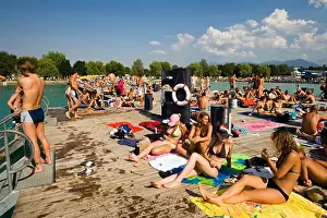 Alps Prints: Young people sunbathing on landing stage at Strandbad Klagenfurt