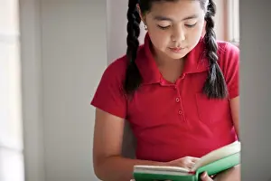 Corridor Prints: Young schoolgirl reading a book