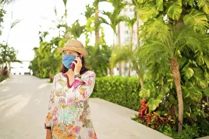 Notebook Prints: Young smiling woman talking on the phone in the backyard of her house