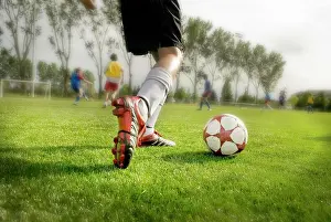Soft Focus Prints: Young Soccer Player About To Kick Ball
