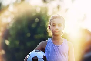 Soccer Prints: Young soccer player ready for the game at sunset