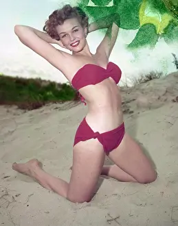 One Young Woman Only Prints: Young woman in bikini posing on beach