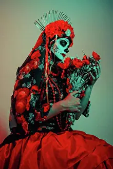 Culture Prints: Young woman in calavera style with Mexican skull make-up on her face
