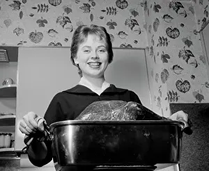 Meat Prints: Young woman carrying roast turkey