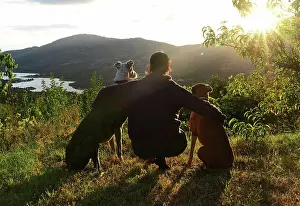 Share Prints: Young woman with her dogs at sunset