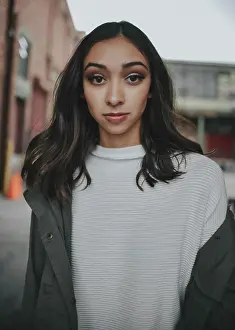 Life Styles Prints: A young woman with long black hair wearing make up in a white shirt and grey jacket
