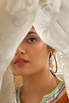 Expressive Prints: A YOUNG WOMAN LOOKING AT CAMERA FROM WITHIN A WHIITE CLOTH