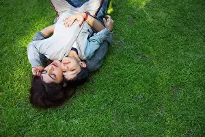 4 5 Years Prints: Young woman lying on the grass with her son