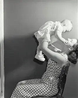 Lifting Prints: Young woman playing with her daughter