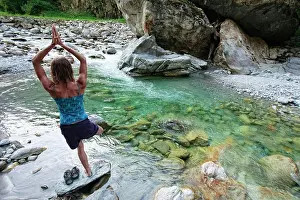 Agility Prints: Young woman practicing yoga.Tirol, Austria