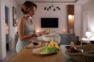 Prepare Prints: Young woman preparing avocado salad