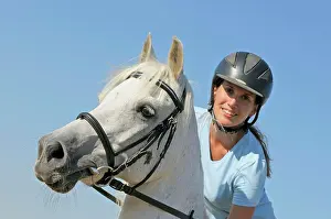 Helmet Prints: young woman riding on Bavarian warmblood horse