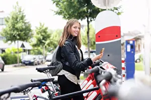 Bicycle Prints: Young woman using bike sharing system