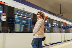 Jeans Prints: young woman waiting for the subway after shopping