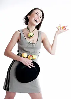Cutting Prints: Young woman wearing a dress with organic apples