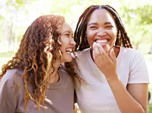 Thought Prints: Young women and friends with funny joke laugh together in park for bonding