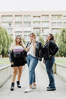 Small Group Of People Prints: Three young women outside their apartment block
